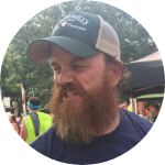 Picture of James with a beard and wearing a cap